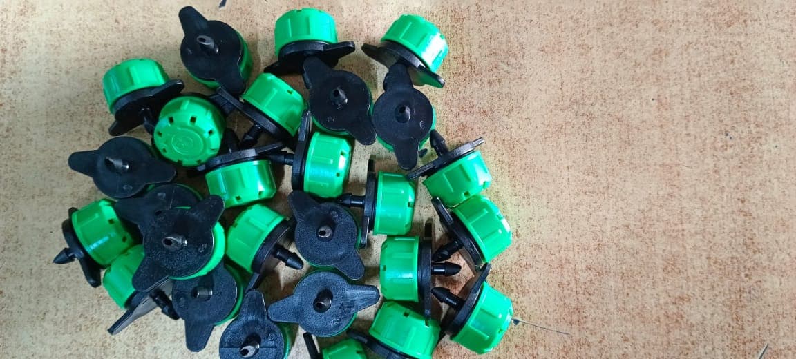 Green adjustable button dripper